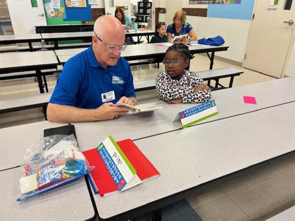 student with a reader